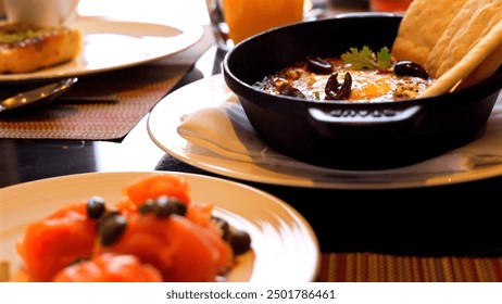 Delicious dish served on white plate featuring salmon, fried eggs, and carrots. VIbrant colors and appetizing arrangement make it perfect for themes of gourmet cuisine and healthy eating. - Powered by Shutterstock