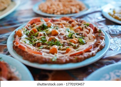 Delicious Dishes Of Traditional Omani Food Served On Carpet In Traditional Restaurant, Oman