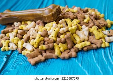 Delicious Dog Treats. Dog Bones And Biscuits On Turquoise Wooden Background