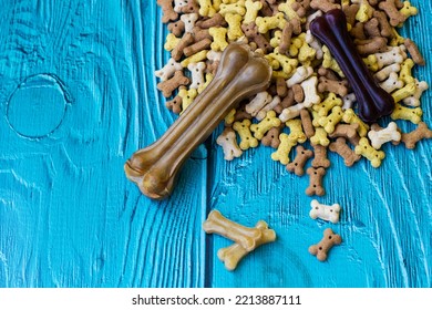 Delicious Dog Treats. Dog Bones And Biscuits On Turquoise Wooden Background