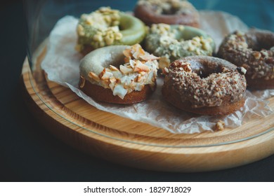 Delicious donuts in cafe.Doughnuts baked in pastry shop for lunch meal.Fresh bakery products prepared for breakfast in Italian cafe.Dessert food cooked with natural ingredients,sweetener with no sugar