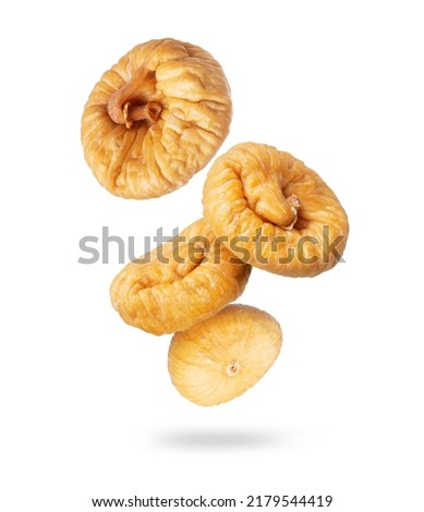 Delicious dried figs in the air closeup on a white background