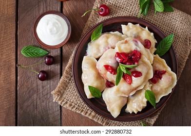 Delicious dumplings with cherries and jam. Top view