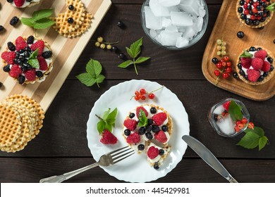 Delicious Eaten Berry Cake On A White Plate. Served With Lemonade, Ice, Mint, Berry And Flowers On Wooden Table. Silver Knife And Fork. Horizontal Image. Top View. View From Above