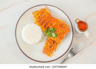 Delicious Fish Breast  And White Rice With Spicy Sauce On The White Tabletop View