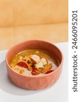 Delicious Fish Soup with Two Varieties of Fresh Fish in a Rustic Bowl.