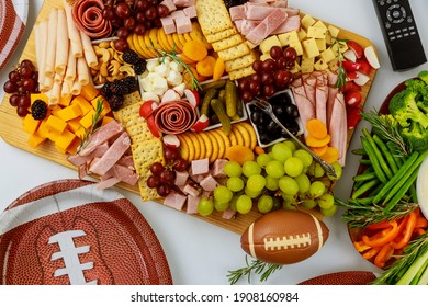 Delicious Food For American Football Game Party With Remote Control For Watching Sport On Tv Channel.