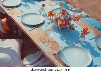 Delicious Food And Flowers For Outdoor Summer Or Spring Picnic. Lunch On The Beach In Romantic Colors