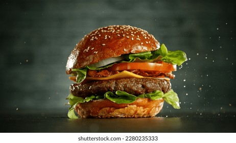 Delicious fresh cheeseburger with old grey background. Fresh american kitchen.