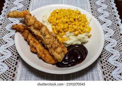 Delicious Fresh Cooked Chicken Tenders With Barbecue Sauce With Mashed Potatoes And Corn 