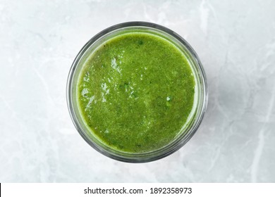 Delicious Fresh Green Juice On Grey Marble Table, Top View