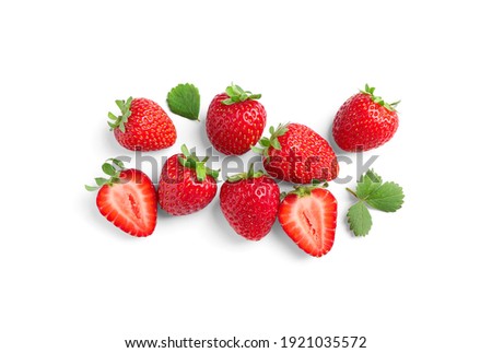 Delicious fresh red strawberries and green leaves on white background, top view