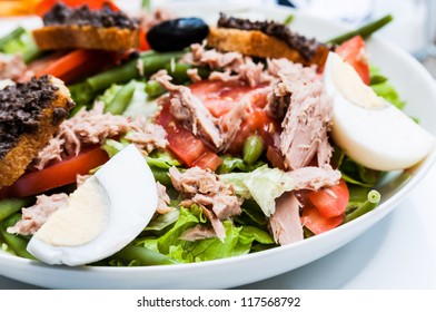 Delicious fresh salad and olive oil