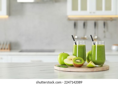 Delicious fresh smoothie and ingredients on white marble table in kitchen. Space for text - Powered by Shutterstock