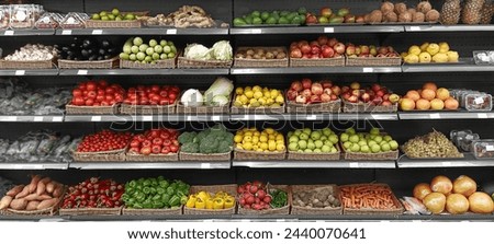 Delicious fresh vegetables and fruits at the refrigerated section of a supermarket. Retail display of organic vegetables at a grocery. big choice of fresh fruits and vegetables on market counter