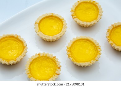 Delicious Freshly Baked Egg Tarts On  White Plate. Top Down View