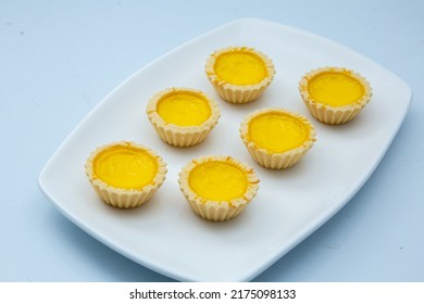 Delicious Freshly Baked Egg Tarts On  White Plate. Top Down View