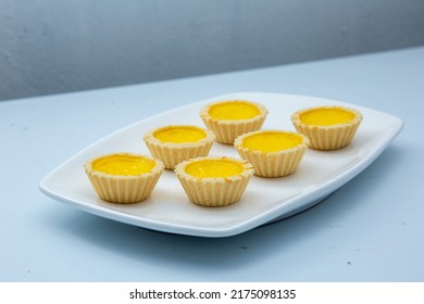 Delicious Freshly Baked Egg Tarts On  White Plate. Top Down View