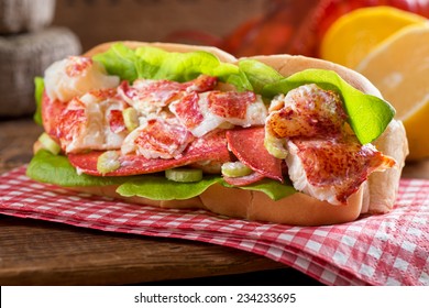 A delicious freshly made lobster roll with lobster, lemon, celery, and mayonnaise.