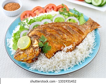 Delicious Fried Fish With Boiled Rice And Salad