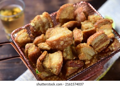 delicious fried pork rinds, typical Brazilian food served in a metal basket - Shutterstock ID 2161574037