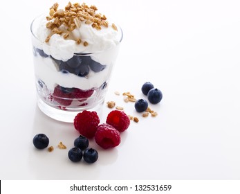 Delicious Fruit, Greek Yogurt And Granola Parfaits On White Background