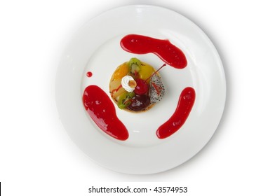 A Delicious Fruit Tart.  Overhead Plated Shot On White