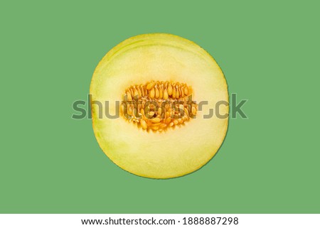 delicious galia melon (cucumis melo) - background green
