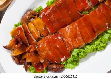 Delicious, Golden Roasted BBQ Suckling pig Cantonese Style.  - Shutterstock ID 1310615510