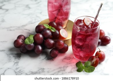 Delicious Grape Soda Water With Mint And Berries On White Marble Table. Refreshing Drink