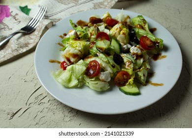 Delicious Greek salad that makes you want to eat. Fresh herbs, ripe tomatoes with balsamic sauce.