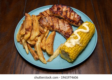 Delicious Grilled Boneless Pork Chops Fresh Cut Fries And Sweet Corn On The Cob