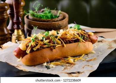 Delicious grilled hotdog in a restaurant, Homemade Bacon Wrapped Hot Dogs with Onions and Peppers
