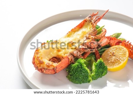 Delicious grilled lobsters and cheese on white plate