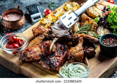 Delicious Grilled Meat With Vegetable. Mixed Grilled Bbq Meat With Vegetables On Wooden Platter. Restaurant Menu, Dieting, Cookbook Recipe Top View,