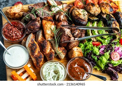 Delicious Grilled Meat With Vegetable. Mixed Grilled Bbq Meat With Vegetables On Wooden Platter. Restaurant Menu, Dieting, Cookbook Recipe Top View,