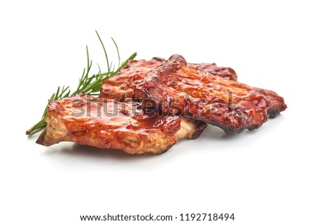 Delicious grilled pork ribs in BBQ sauce with herbs, isolated on white background