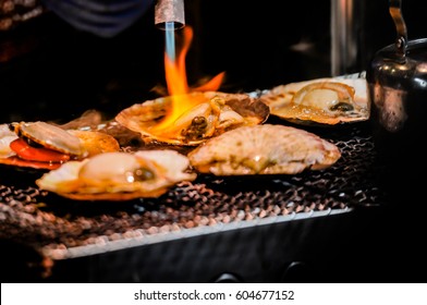 Delicious Grilled Scallop Cooking On Fire, Street Food In Tokyo