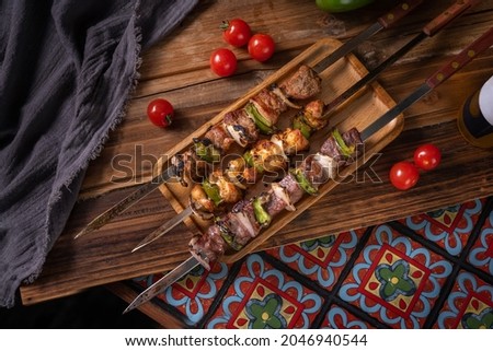Delicious grilled screwers made by chicken, beef and lamb meat.