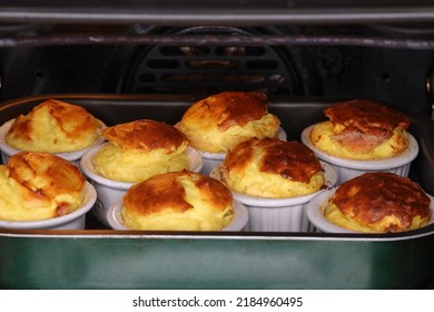 Delicious Group Of Pecorino Cheese Souffle In A Water Bath In The Oven