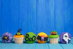 Delicious Halloween Cupcakes Set With Bright Decorations Made Of Confectionery Mastic. Halloween Sweets, Homemade Confectionery, Holiday Food, Trick Or Treat Concept