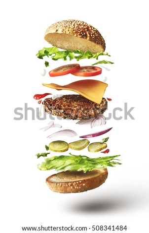 Delicious hamburger with flying ingredients on white background