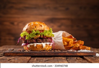 Delicious hamburger served on wooden planks - Powered by Shutterstock