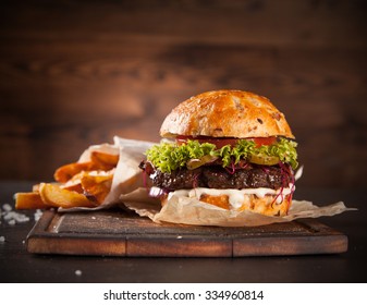 Delicious hamburger served on wooden planks - Powered by Shutterstock