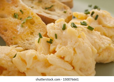 Delicious And Healthy Breakfast Of Fluffy Scrambled Eggs With Toast.