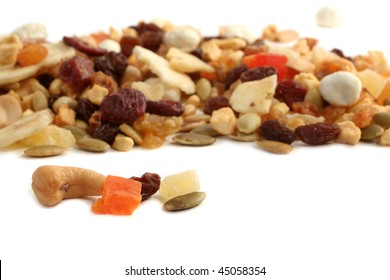 Delicious and healthy mixed dried fruit, nuts and seeds on a white background - Shutterstock ID 45058354