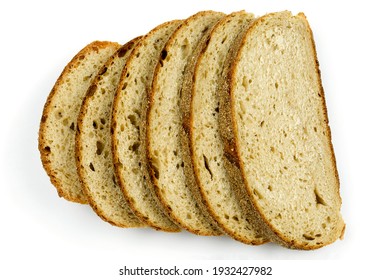Delicious and healthy sliced chunks of whole wheat bread with a crispy crust close-up on a white isolated background. The concept of a healthy lifestyle and proper nutrition
