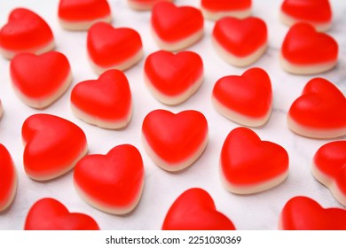 Delicious heart shaped jelly candies on white table, closeup - Powered by Shutterstock