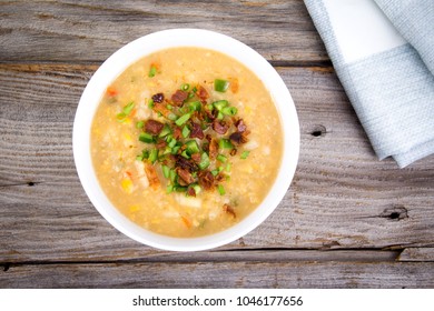 delicious home made corn chowder cream soup bowl closeup on tablecloth