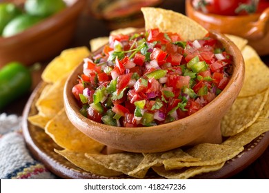 A delicious home made salsa pico de gallo with tomato, red onion, lime, cilantro, and jalapeno pepper.
